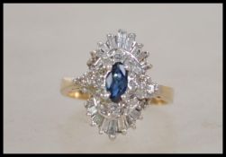 A ladies 14ct yellow gold, sapphire and diamond ri