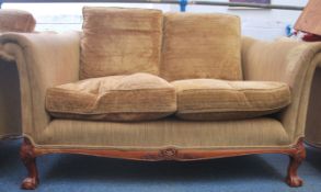 A good antique style sofa settee raised on claw an