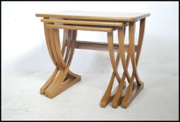 A nest of three Nathan teak tables, the rectangula