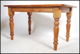 A 20th century antique country style pine dining t