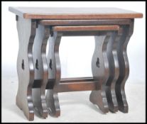 A good set of Jacobean revival oak nest of tables