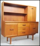 A retro 1970's teak tall sideboard of Danish influ