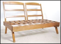 A retro 1970's modular wooden panel sofa day bed.