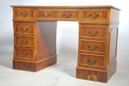 An antique Georgian style mahogany yew wood twin p