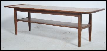 A 1970's teak wood surfboard style coffee table be