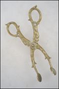 A pair of 19th century brass sugar nips. The handl