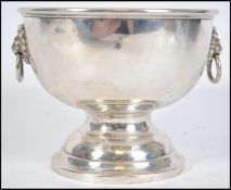 A silver hallmarked pedestal bowl having twin lion