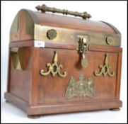 A stunning dome top mahogany and brass Casket