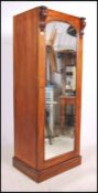 A Victorian mahogany sentry box wardrobe having pl