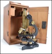 A brass and japanned metal microscope by F Koristk