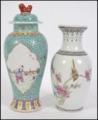 An Oriental Cantonese vase having a waisted neck a