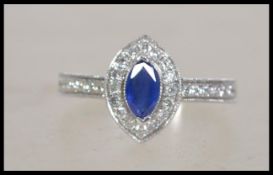 An 18ct white gold sapphire and diamond lozenge sh