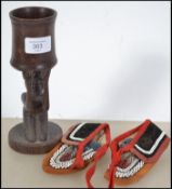 A vintage 20th century carved African beaker toget