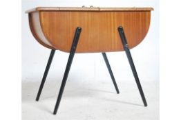 A good mid century sewing box cabinet being raised