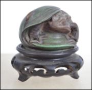 A bronze style paperweight in the form of a toad,
