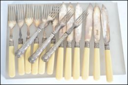 A six person setting of silver collared fish cutle