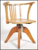 A 1930's solid oak Industrial captains office swiv