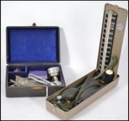 A collection of vintage doctors apparatus to inclu