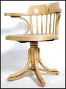 A retro 20th century bentwood office swivel chair