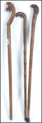 A collection of 3 vintage hardwood walking sticks,