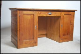A 19th century French fruitwood twin pedestal desk