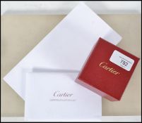 An original Cartier platinum band ring complete in