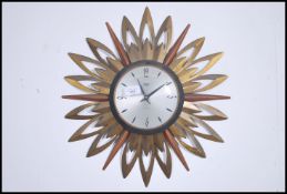 A mid century Smiths Astral retro wall clock havin