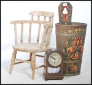 A Victorian childs smokers bow armchair raised on