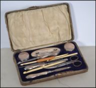 A leather cased silver hallmarked manicure set. Bi