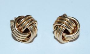 A pair of 9ct gold knot earrings with post backs.