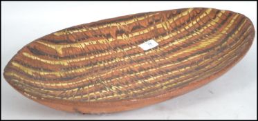 A retro 20th century studio pottery dish in the manner of Leaper having twizzle glaze decoration