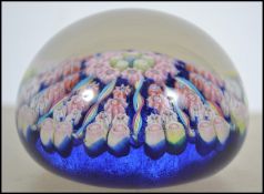 A  believed early 20th century millefiori paperweights  blue  glass inner bases to the canework