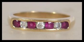 A 9ct gold hallmarked 7 stone ring set with 3 roun