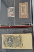A collection of vintage banknotes all held within