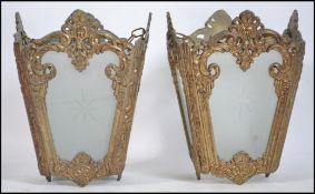 A pair of mid to late century gilt metal rococo an