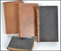 A small collection of books ( four ) dating from t