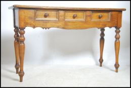 A Victorian style hardwood writing table - console