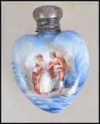 A silver and ceramic heart shaped ladies perfume b