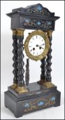 A  late 19th century French Portico mantle clock,