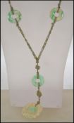 A Qing dynasty Chinese silk strung jade and neckla