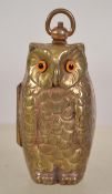 An unusual  brass cased owl shaped sovereign case