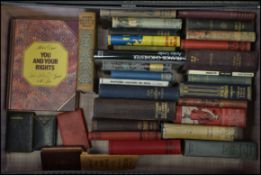 A collection of vintage books to include paper bac