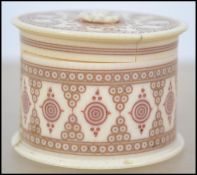 A 19th century carved Ivory round / cylindrical la