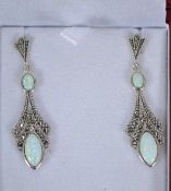 A pair of silver marcasite and opal drop earrings