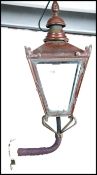 An early 20th century copper wall mounted street l