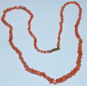 A vintage 9ct gold coral bead necklace with a 9ct
