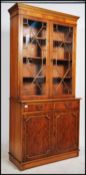 A Regency style yew wood veneer library bookcase c