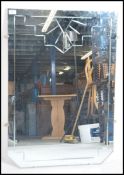 A 1930's Art Deco wall mirror of square from havin