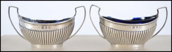 A pair of twin handled silver hallmarked table sal