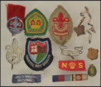 A collection of vintage Boy Scouts badges and patc